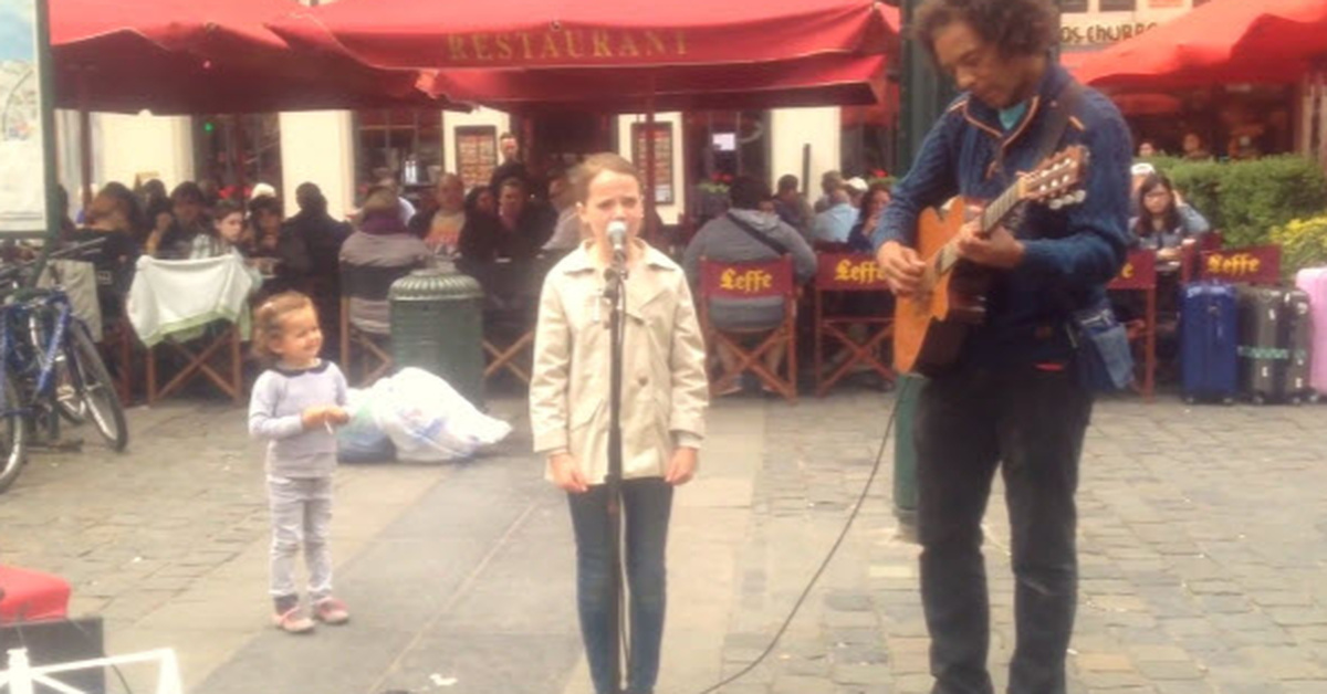 young-girl-and-street-performer-sing-ave-maria-and-everyone-has